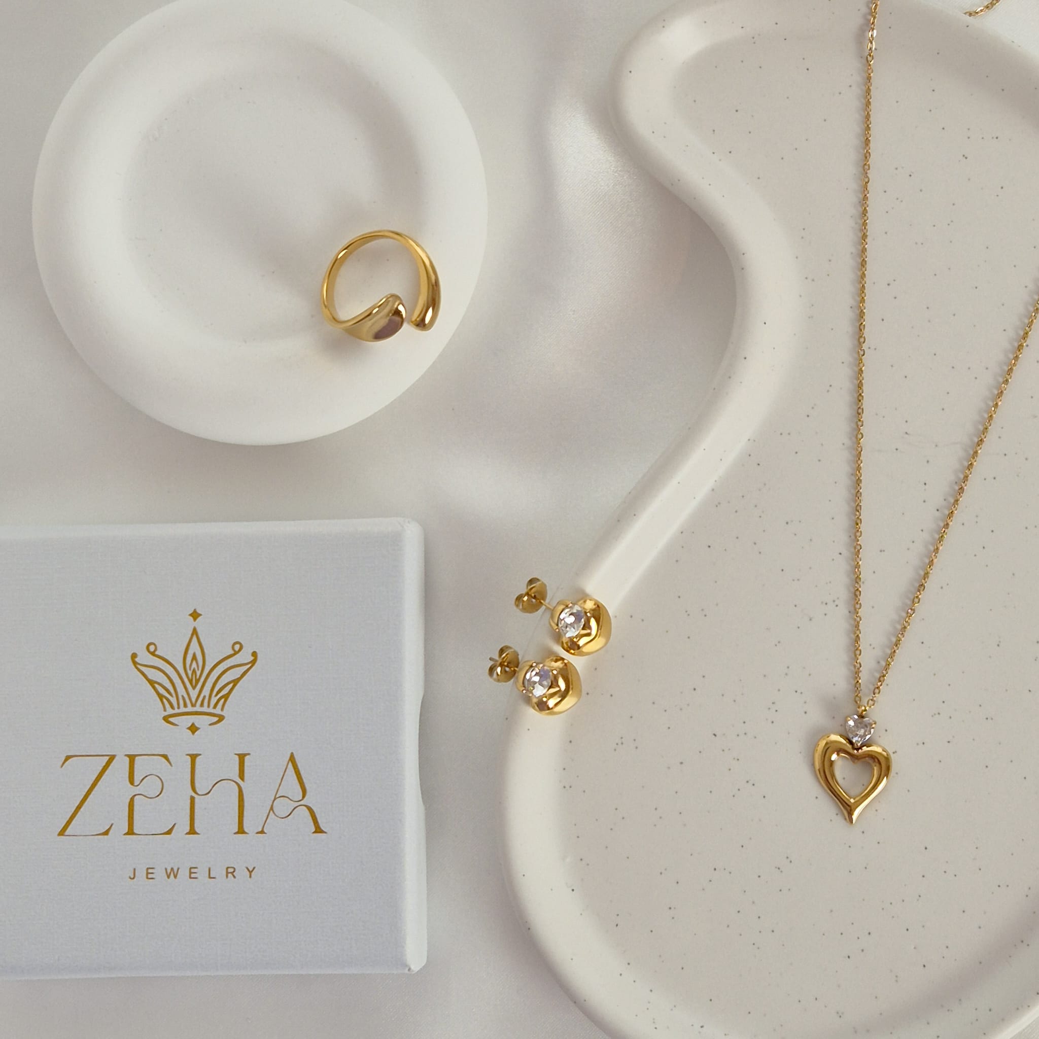 A perfect trio- heart earrings, heart necklace and gold ring